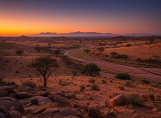 Fototapeta premium Serene Desert Landscape at Dusk with River and Mountains in Background