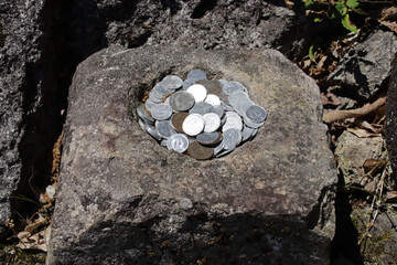 coins offerings in a religious (buddhist ?) complex in yamadera in japan 
