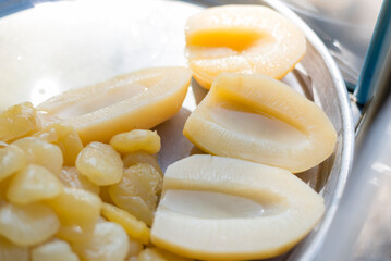 Closeup to Sake in syrup in tray 