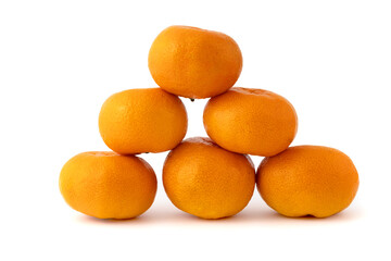 Whole and sliced tangerines with green leaf on black background mandarin orange