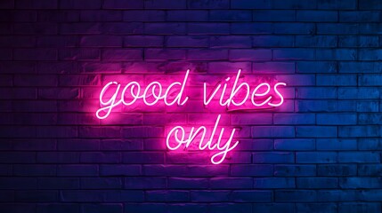 Good vibes only pink neon sign on dark blue brick wall, motivational quote
