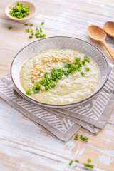 Delicious winter soup from Jerusalem artichoke (sunroot), full of fibre with green onions