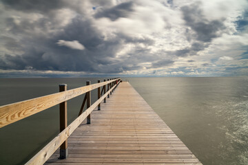 Obraz premium view of the Falsterbo Brygga bathing facility pier on the Baltic Sea shore of southern Sweden