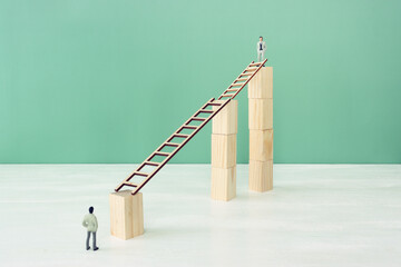 business concept of challenge. man figures stand in front ladder. Teamwork and problem solving idea