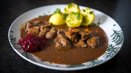 ready to eat - goulash from venison with potatoes and cranberry jam