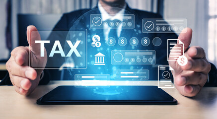 A businessman showcases tax and finance data using a digital hologram interface on a tablet in an office, emphasizing modern financial management and innovation. Gantry