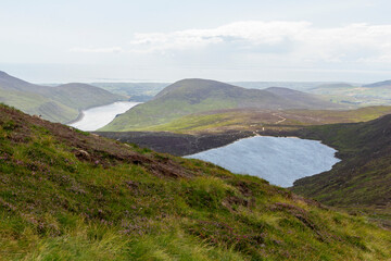 view from the Mourne Mountains down to the big Silent Valley Reservoir at a sunny summer day in ireland