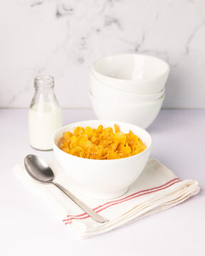 Cereal bowl and milk on a white background