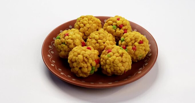 indian sweet motichoor laddoo&nbsp;or Bundi laddu made of gram flour very small balls or boondis which are deep fried and soaked in sugar syrup before making balls