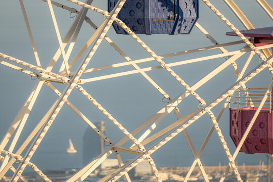 Ferris wheel at sunset in Tibidabo with city view