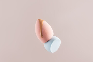 Foundation on pastel makeup sponges for beauty and care