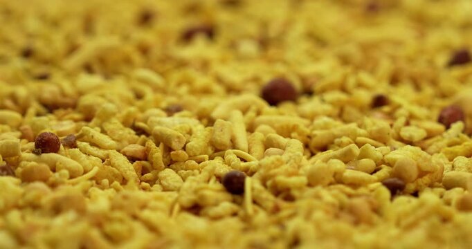  Traditional indian deep fried salty dish - chivda or farsan or namkeen made of gram flour and mixed with dry fruits, selective focus