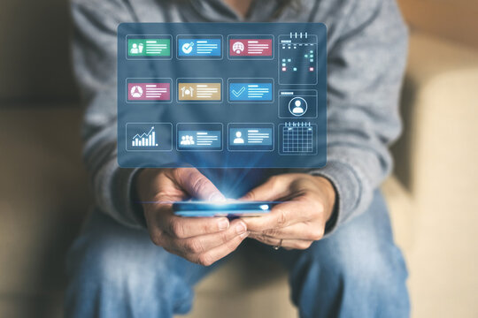 User Utilizing a Smartphone to Access a Holographic Dashboard for Business Management Project Monitoring and Data Analysis - Powered by Adobe