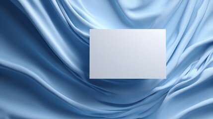 A white card or placard floating slightly above a massive expanse of flowing, draped fabric.