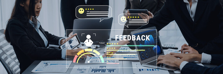 A dynamic business team engages in a collaborative effort to discuss feedback strategies using advanced technology in a modern office setting. Trope
