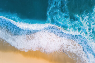 Close-Up Aerial View of Ocean Waves Reaching Sandy Beach
