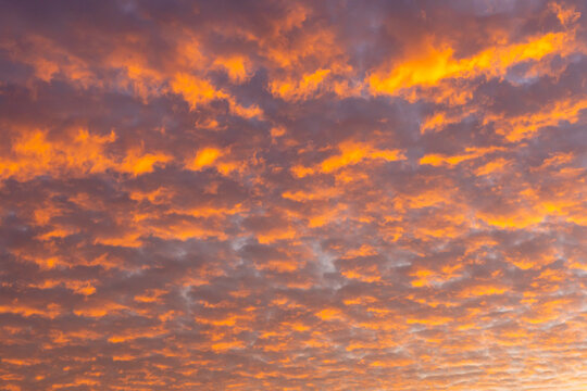 Sunset clouds with vibrant hues of orange and purple