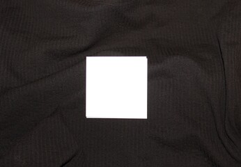 A white sheet of paper on a black background