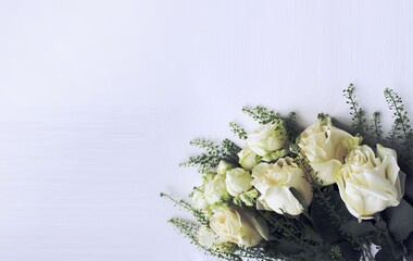 Bouquet of white roses on a white background with space for text