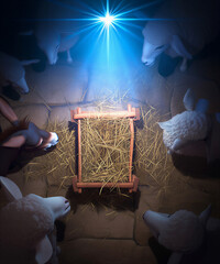 christmas tree and magic lights. Nativity - Waiting Birth Of Jesus Christ With Empty Manger In Snowy Night With Comet Star And Abstract Defocused Bokeh 