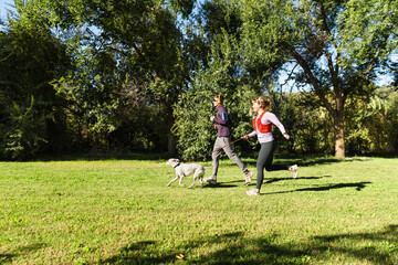 Couple enjoying outdoor fitness with their dog