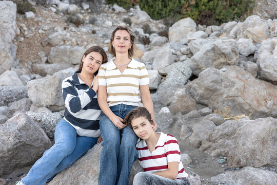 Family time at the beach featuring mother and daughters