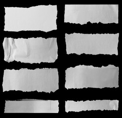 Torn papers on black