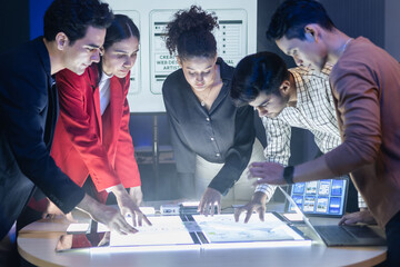 Diverse team of developers and designers having project discussion and strategy meeting. Reviewing digital data, brainstorming UX UI and web design for application development. Startup teamwork