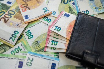 Euro cash and wallet symbol of wealth and economic balance