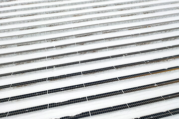 Renewable energy concept. Aerial drone view of solar panels power plant in winter, Norway