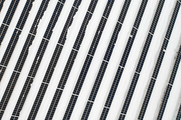 Renewable energy concept. Aerial drone view of solar panels power plant in winter, Norway
