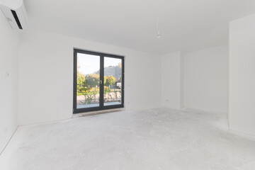 Bright empty room interior with white walls and air conditioner