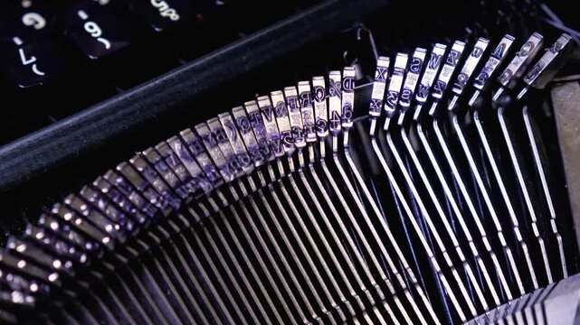 Writer Typing on Old Writing Machine. View from Above on Typewriter on Letter Impact Stamp Moving While Typing on Keyboard Close Up