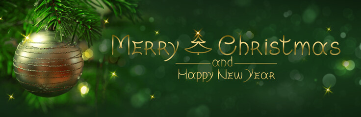 Christmas golden ball on green fir tree branch .