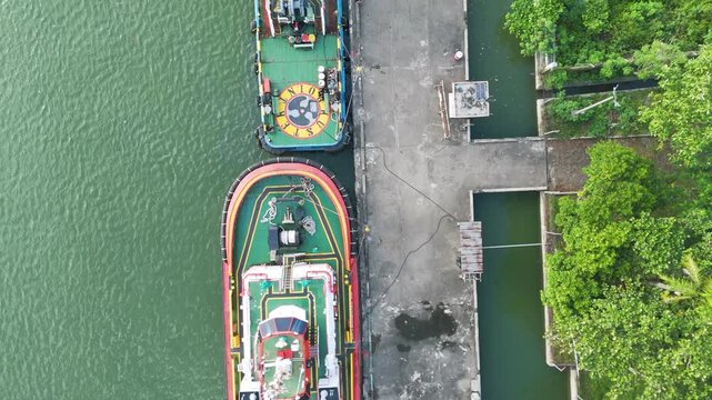 Top View Tugboat Preparing for Industrial Barge Towing