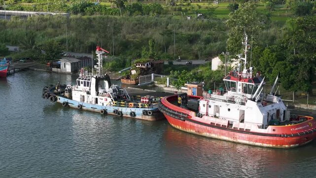 Tugboat Supporting Barge Operations in Industrial Waterway