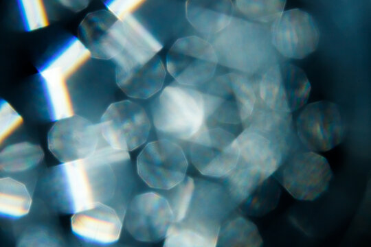 Lens Flare. Light over black background. Easy to add overlay or screen filter over photos. Abstract sun burst with digital lens flare background. Gleams rounded and hexagonal shapes, rainbow halo. big