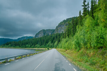 Road along lake in Sweden Lapland wilderness
