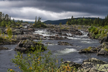 Sweden Lapland river rapids flowing through natural wilderness