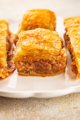 Baklava with pistachios and almonds dessert oriental sweets natural product tasty snack fresh delicious gourmet food background on the table rustic top view copy space
