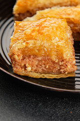 Baklava with pistachios and almonds dessert oriental sweets natural product tasty snack fresh delicious gourmet food background on the table rustic top view copy space