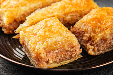 Baklava with pistachios and almonds dessert oriental sweets natural product tasty snack fresh delicious gourmet food background on the table rustic top view copy space