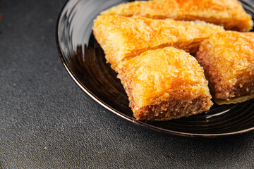 Baklava with pistachios and almonds dessert oriental sweets natural product tasty snack fresh delicious gourmet food background on the table rustic top view copy space