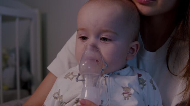 Infant receiving non-invasive nebulization treatment at home, close-up view of child with mask, gentle camera zoom in, showcasing care and comfort during therapy session