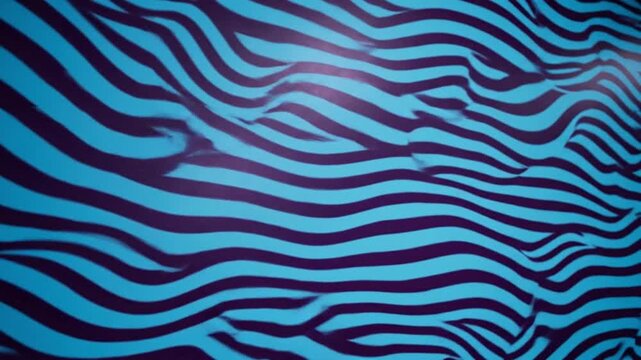 Close up video of wavy blue and black zebra print fabric texture