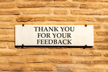 Thank you for your feedback symbol. Concept words Thank you for your feedback on white marble sign...