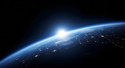 Earth from space sunrise over city lights planet globe