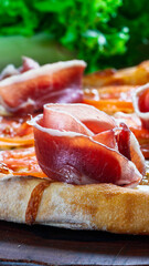 Parma ham and mozzarella pizza