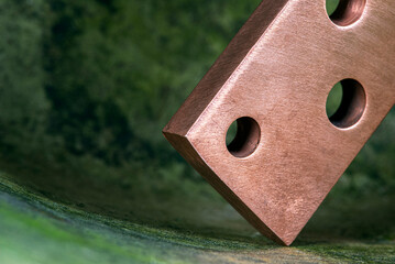 Copper busbar in a patinated industrial space, products of the metallurgical industry