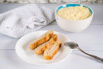 Whole grain baguette made from buckwheat flour and sesame seeds, and salad with egg